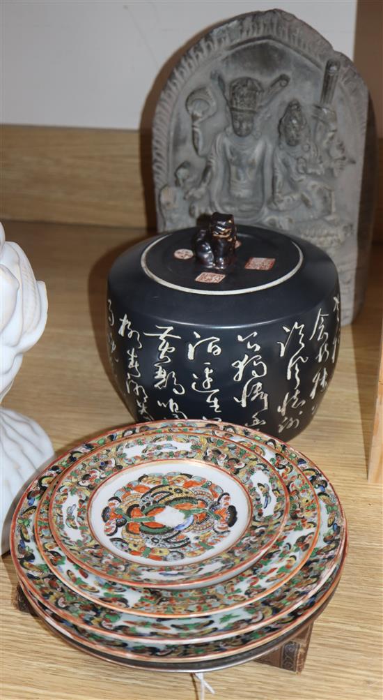 A quantity of mixed Asian wares including porcelain plates, a metalware dish, jar and cover and a stone carving